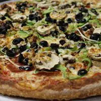 A pizza with olives and mushrooms on top of it.